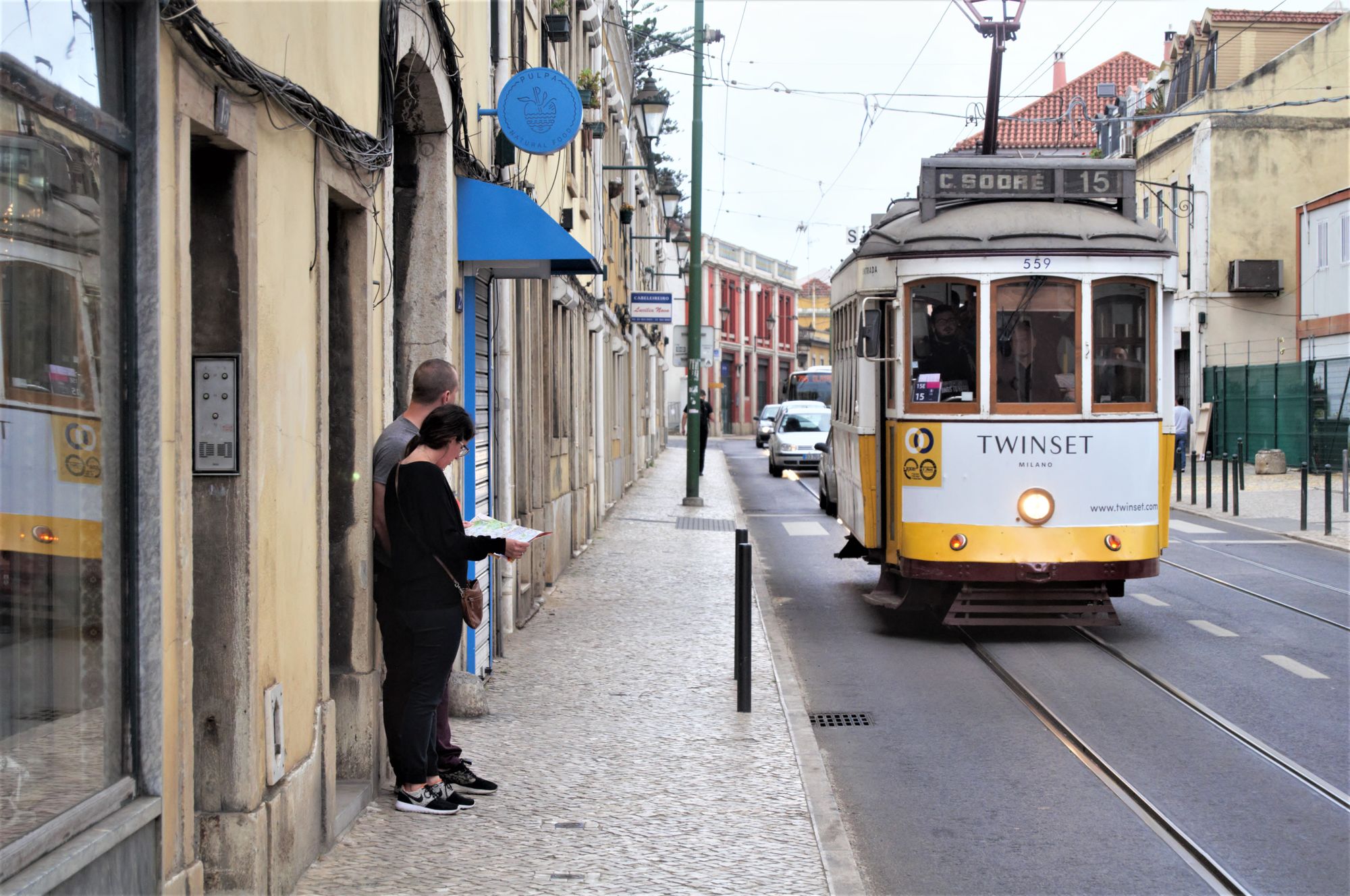 Tourists wait for a trolley in Lisbon, Portugal. 